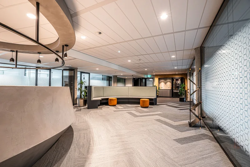 A modern office lobby with glass walls