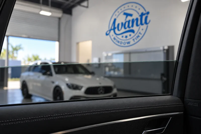 The clean top edge of tinted glass, seen from inside a graphite gray BMW M5