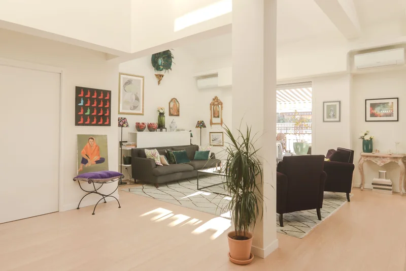 Sunlight across the floor and furniture of a bright living room