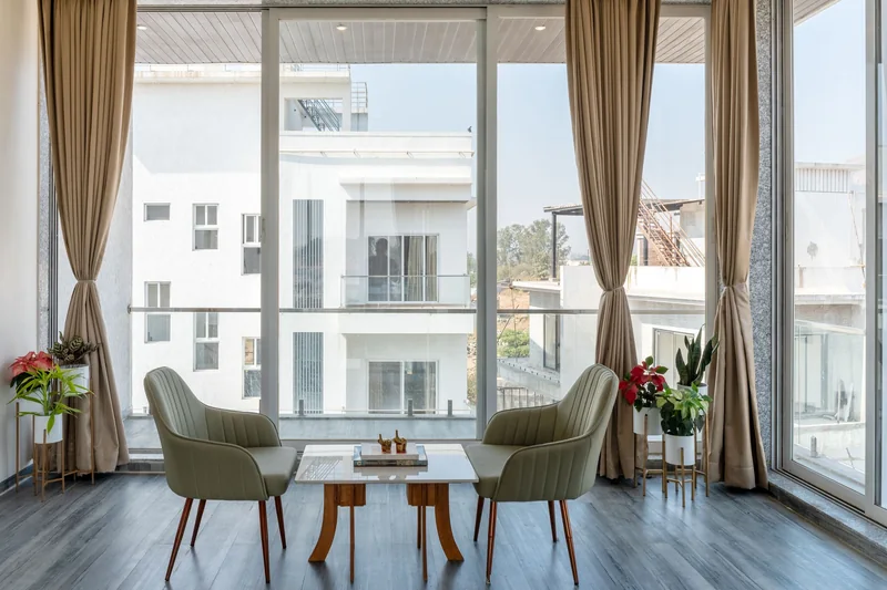 A bright room with floor-to-ceiling windows