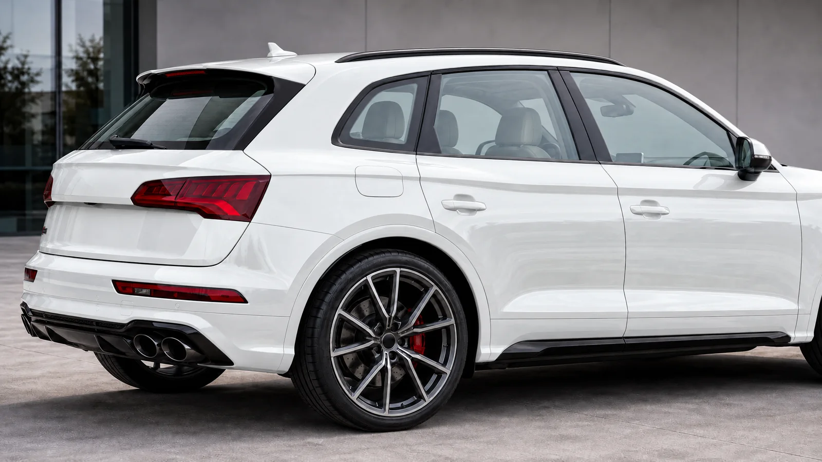 White Audi SQ5 with 35% window tint on the right and clear glass on the left
